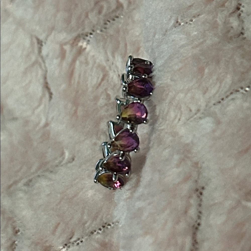 Purple and yellow gemmed ring